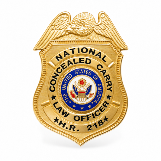 A gold-colored metal concealed carry law officer badge shaped like a shield, featuring an eagle at the top and the text 'NATIONAL CONCEAED CARRY LAW OFFICER' with the United States of America seal in the center, shown on a plain white background.